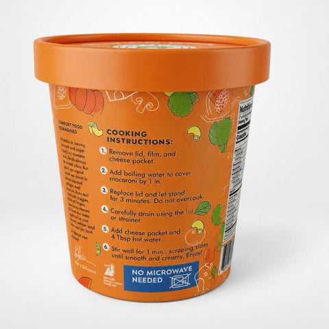 An orange plastic container of Hidden Foods Co macaroni and cheese with a matching orange lid, showing the cooking instructions on the side against a light gray background.